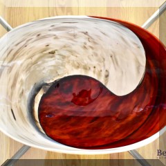 D47. Red and ivory Yin and Yang swirl ceramic oval bowl. 6”h x 16”w x 10”w - $48 